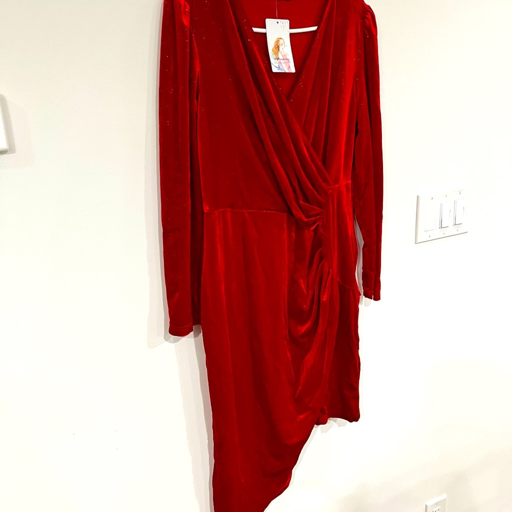 A symmetrical velour red sparkly dress